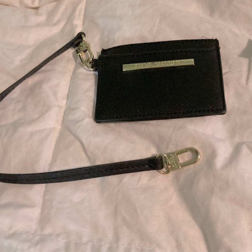 Brand new with plastic still on mirror Steve Madden card